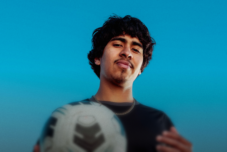 Photo of Alex, a young male athlete holding a soccer ball.