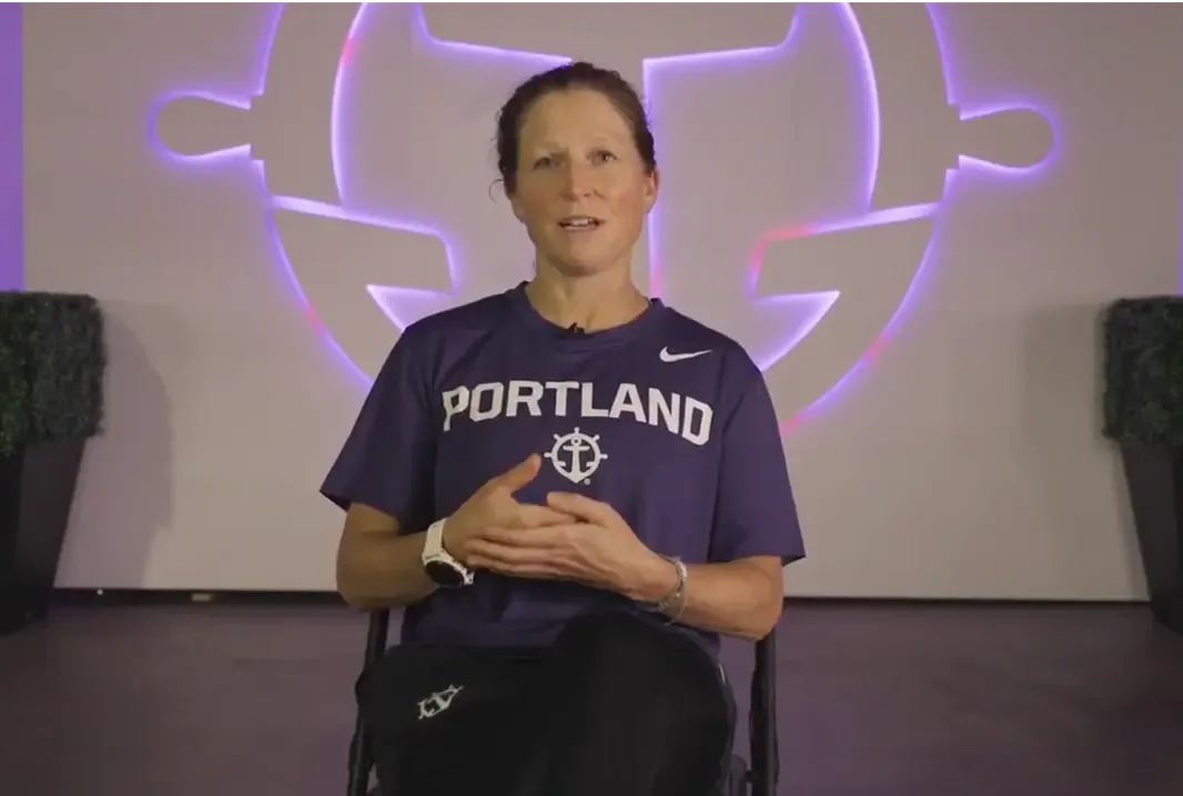 Michelle French, the head coach for the University of Portland women's soccer team, sits during an interview.